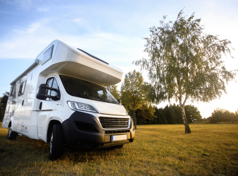 solar powered motorhome in a field in new zealand