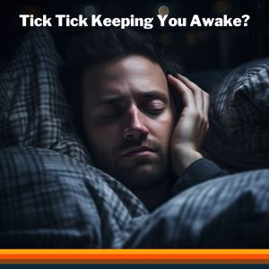 Man in cozy pajamas attempting to sleep, covering his ear. Dealing with the ticking noise from a diesel heater with a touch of humour.